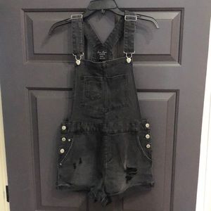 Small, black, distressed denim overalls